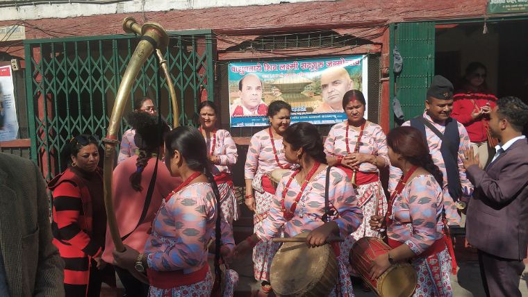 Women playing panche baja drums at a celebration