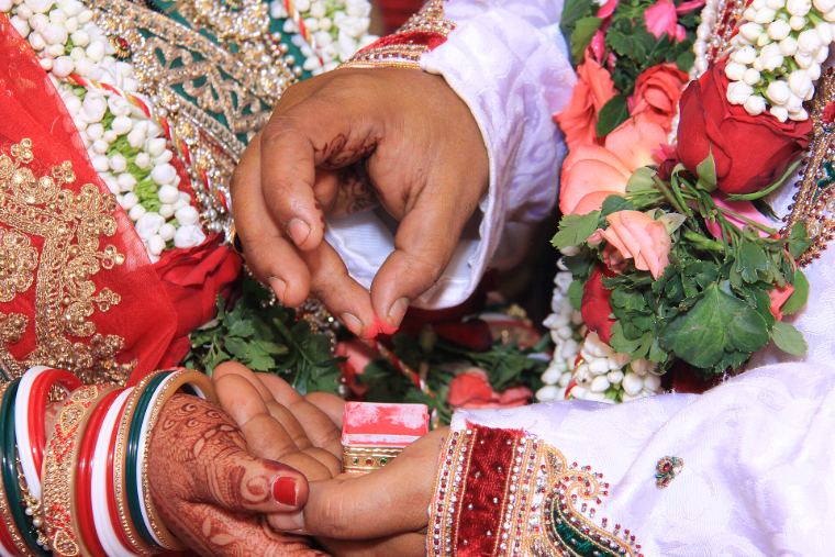 Sindoor being applied during a wedding